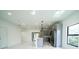 Stylish kitchen with stainless steel appliances and a spacious island open to the living area at 3920 Wisteria Pl, Punta Gorda, FL 33950