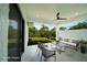 Bright and airy covered patio with white tile flooring and a seating area at 3920 Wisteria Pl, Punta Gorda, FL 33950