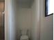This private toilet room features modern fixtures and clean, neutral finishes at 3920 Wisteria Pl, Punta Gorda, FL 33950