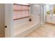 Bathroom features a soaking tub with a shower, tile floors, and natural light at 4027 Quaker Ln, North Port, FL 34288