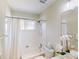 Bright bathroom features a shower-tub combo, and vanity with ample counter space at 4027 Quaker Ln, North Port, FL 34288