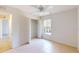 Bright bedroom with tile flooring, ceiling fan, and natural light at 4027 Quaker Ln, North Port, FL 34288