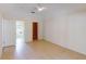 Large bedroom with tile floors, neutral walls, and access to a bathroom at 4027 Quaker Ln, North Port, FL 34288