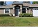 Well maintained single story home with lush landscaping and beautiful lawn at 4027 Quaker Ln, North Port, FL 34288