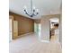 Bright living room with tile floors, backyard access, and an open floor plan at 4027 Quaker Ln, North Port, FL 34288
