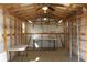 Inside of storage shed has shelving and tables, and is brightly lit with multiple lights at 4027 Quaker Ln, North Port, FL 34288