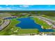 Aerial view of a Primary-planned community featuring multiple lakes, golf courses, and green spaces under a partly cloudy sky at 43030 Greenway Blvd # 426, Punta Gorda, FL 33982