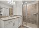 Well-lit bathroom featuring granite countertops, a modern sink and a glass-enclosed shower at 43030 Greenway Blvd # 426, Punta Gorda, FL 33982