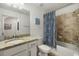 Bathroom with granite countertop vanity, tile floors, and shower-tub combo at 43030 Greenway Blvd # 426, Punta Gorda, FL 33982