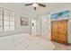 Comfortable bedroom features a TV on a wooden dresser, creating a cozy retreat at 43030 Greenway Blvd # 426, Punta Gorda, FL 33982
