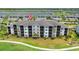 Spacious condo building featuring screened balconies, perfect for enjoying the outdoors at 43030 Greenway Blvd # 426, Punta Gorda, FL 33982