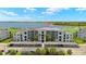 Stunning aerial view of the condo complex, showcasing lush landscaping and convenient covered parking at 43030 Greenway Blvd # 426, Punta Gorda, FL 33982