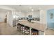 Bright kitchen features stainless steel appliances, white cabinetry, and a large island with seating at 43030 Greenway Blvd # 426, Punta Gorda, FL 33982