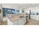 Bright open floor plan featuring a kitchen with stainless steel appliances and large center island at 43030 Greenway Blvd # 426, Punta Gorda, FL 33982