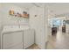 Well-lit laundry room featuring side by side washer and dryer with storage space at 43030 Greenway Blvd # 426, Punta Gorda, FL 33982