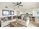 Open-concept living room featuring modern decor, an eat-in kitchen and a comfortable sofa at 43030 Greenway Blvd # 426, Punta Gorda, FL 33982