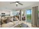 Bright living room with seamless access to a screened patio with lake views at 43030 Greenway Blvd # 426, Punta Gorda, FL 33982
