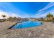 A beautifully designed community pool with lounge seating and palm trees, perfect for relaxation on a sunny day at 43030 Greenway Blvd # 426, Punta Gorda, FL 33982