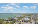 Beautiful aerial view of the community with solar panels, vibrant buildings, and serene waterfront at 43984 Boardwalk Loop # 1726, Punta Gorda, FL 33982