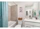 Clean bathroom with white fixtures, vanity, and tiled shower-tub combo at 43984 Boardwalk Loop # 1726, Punta Gorda, FL 33982