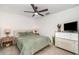 Cozy bedroom with modern decor, a ceiling fan, and a soft color palette at 43984 Boardwalk Loop # 1726, Punta Gorda, FL 33982