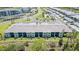 Aerial view of luxury residential neighborhood showcasing townhomes, manicured lawns, and palm-lined streets at 43984 Boardwalk Loop # 1726, Punta Gorda, FL 33982