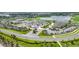 Aerial view of the community with pool, golf, tennis, and clubhouse at 43984 Boardwalk Loop # 1726, Punta Gorda, FL 33982