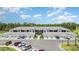 Exterior of newly-constructed townhomes with garages and lush landscaping at 43984 Boardwalk Loop # 1726, Punta Gorda, FL 33982