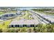 Aerial view of residential community with a mix of townhomes and condo units, surrounded by scenic lakes at 43984 Boardwalk Loop # 1726, Punta Gorda, FL 33982