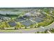 Aerial view of the community featuring tennis courts, pool, and well-maintained landscaping at 43984 Boardwalk Loop # 1726, Punta Gorda, FL 33982