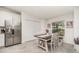 Bright dining area with stainless steel refrigerator at 43984 Boardwalk Loop # 1726, Punta Gorda, FL 33982