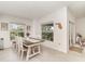 Bright dining area with a view to a lush screened-in patio at 43984 Boardwalk Loop # 1726, Punta Gorda, FL 33982