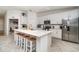 Spacious kitchen with large island, stainless steel appliances, and bar stool seating at 43984 Boardwalk Loop # 1726, Punta Gorda, FL 33982