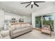 Spacious living room adjacent to the kitchen and screened-in patio at 43984 Boardwalk Loop # 1726, Punta Gorda, FL 33982