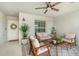 Covered outdoor patio seating area with stylish ceiling fan and decor at 43984 Boardwalk Loop # 1726, Punta Gorda, FL 33982