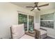 Inviting outdoor patio featuring comfortable wicker seating and views of the living space at 43984 Boardwalk Loop # 1726, Punta Gorda, FL 33982