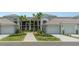 Beautiful townhome featuring a private garage and a meticulously maintained front yard with lush landscaping at 43984 Boardwalk Loop # 1726, Punta Gorda, FL 33982