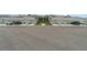 Street view of lovely townhomes, each featuring a private garage and well-manicured landscaping at 43984 Boardwalk Loop # 1726, Punta Gorda, FL 33982