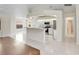 A bright kitchen features white cabinets, tile flooring, and a breakfast bar at 5331 Citadel Rd, Venice, FL 34293