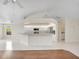 Bright kitchen featuring a breakfast bar, white cabinetry, and stainless steel appliances at 5331 Citadel Rd, Venice, FL 34293