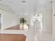 Spacious living area with tile flooring and sliding glass doors to the backyard at 5331 Citadel Rd, Venice, FL 34293