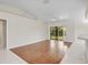 Bright living space with tile floors, a ceiling fan, and access to the patio at 5331 Citadel Rd, Venice, FL 34293