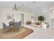 Open-concept living room with tile floors, modern furnishings, and natural light at 5331 Citadel Rd, Venice, FL 34293