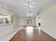Bright open-concept living area features tile flooring and a view to the kitchen at 5331 Citadel Rd, Venice, FL 34293