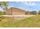 Expansive backyard featuring a screened enclosure and gravel area, perfect for outdoor living and entertaining at 8183 Deland St, Port Charlotte, FL 33981