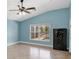 Spacious bedroom with light-blue walls, ceiling fan and a security safe at 8183 Deland St, Port Charlotte, FL 33981