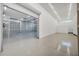 Large, well-lit three-car garage featuring polished concrete floors and ample interior space at 8183 Deland St, Port Charlotte, FL 33981