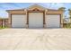 Spacious three-car garage offers ample parking and convenient access with a concrete driveway at 8183 Deland St, Port Charlotte, FL 33981