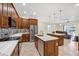 Open kitchen with a dual-island design, stainless appliances and custom cabinets, perfect for cooking and entertaining at 8183 Deland St, Port Charlotte, FL 33981