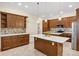 Gourmet kitchen featuring custom cabinetry, marble countertops, and pendant lighting, perfect for culinary enthusiasts at 8183 Deland St, Port Charlotte, FL 33981